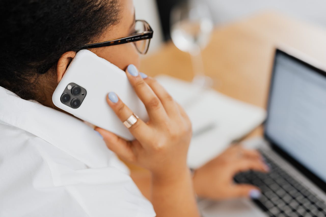 Woman with a smart ring using a cell phone
