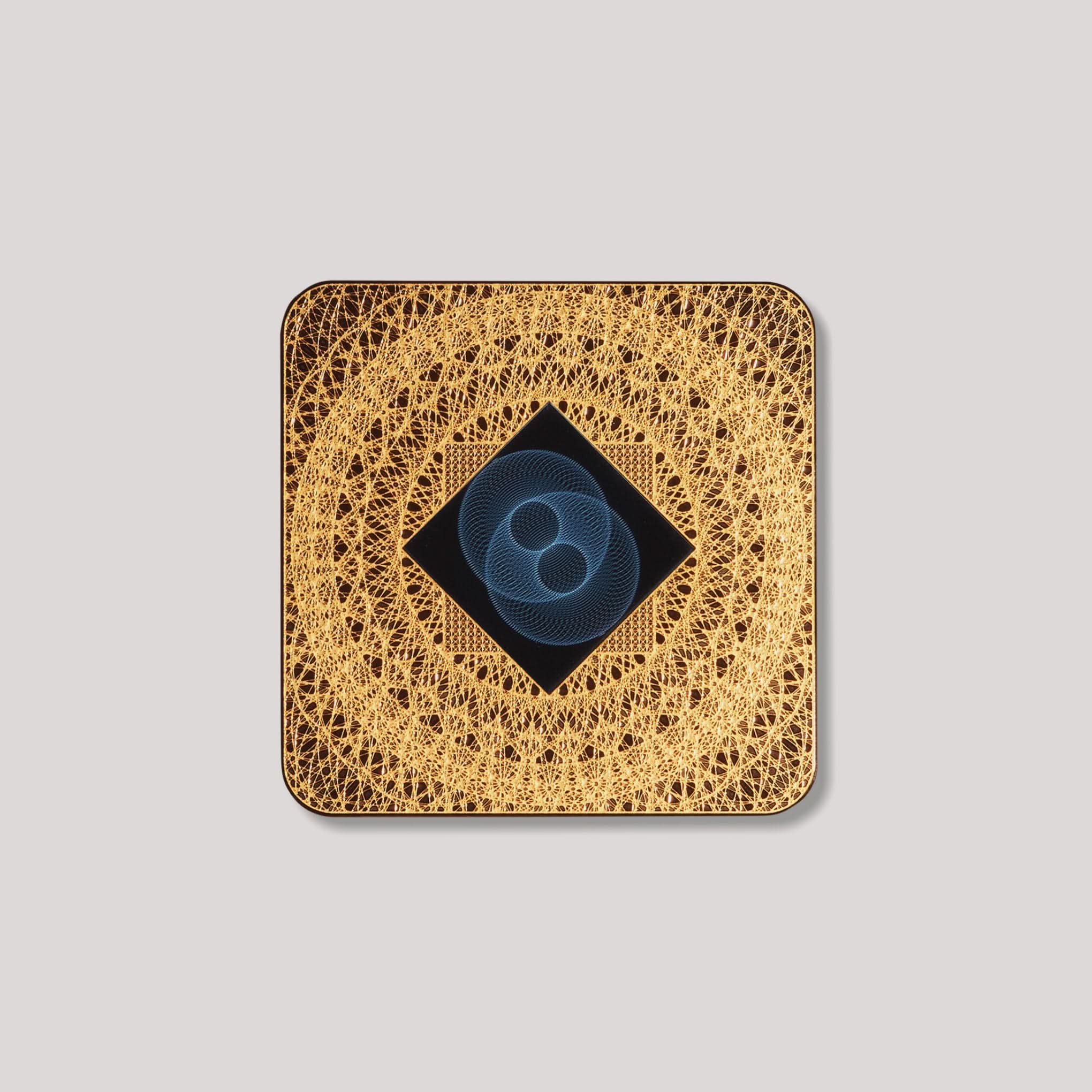 Lifetune Zone EMF protection device with intricate gold design and central resonator pattern.