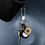 Lifetune Go worn on a keychain attached to a bag with other items to convenient, mobile use.