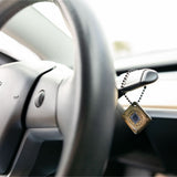 Lifetune Go with military style chain hanging in car for on-the-go EMF protection