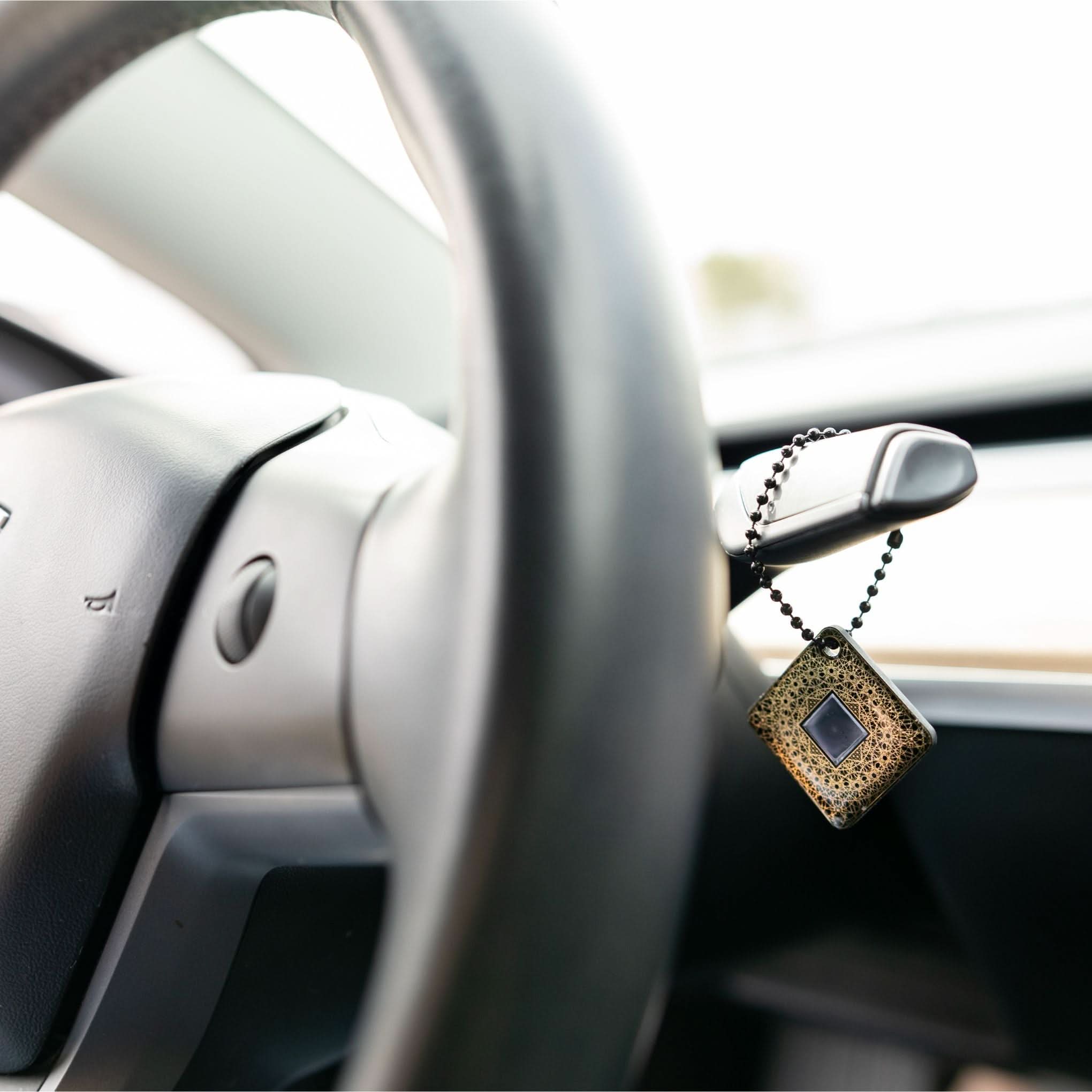 Lifetune Go with military style chain hanging in car for on-the-go EMF protection