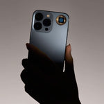 Lifetune One EMF protection sticker applied to the back of an iPhone for daily EMF shielding