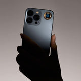 Lifetune One EMF protection sticker applied to the back of an iPhone for daily EMF shielding