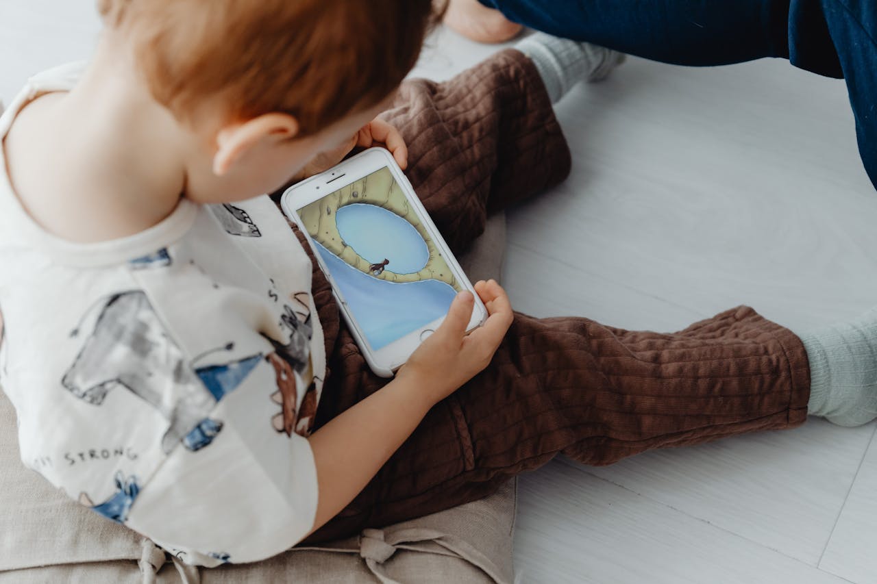 child holding a cell phone