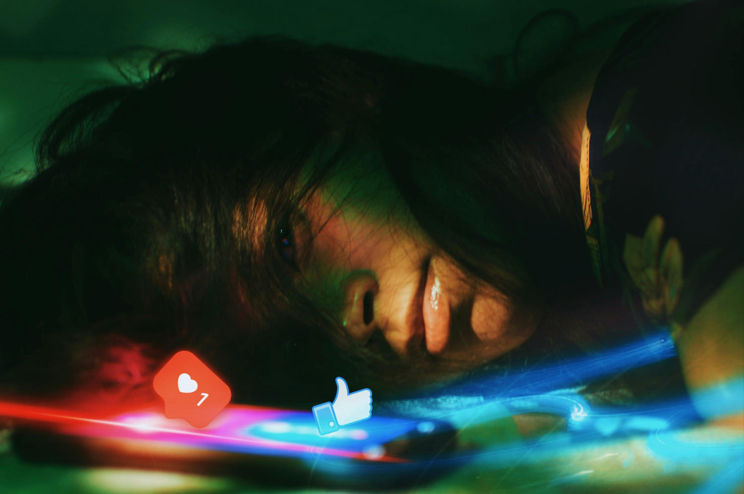 Woman laying beside phone