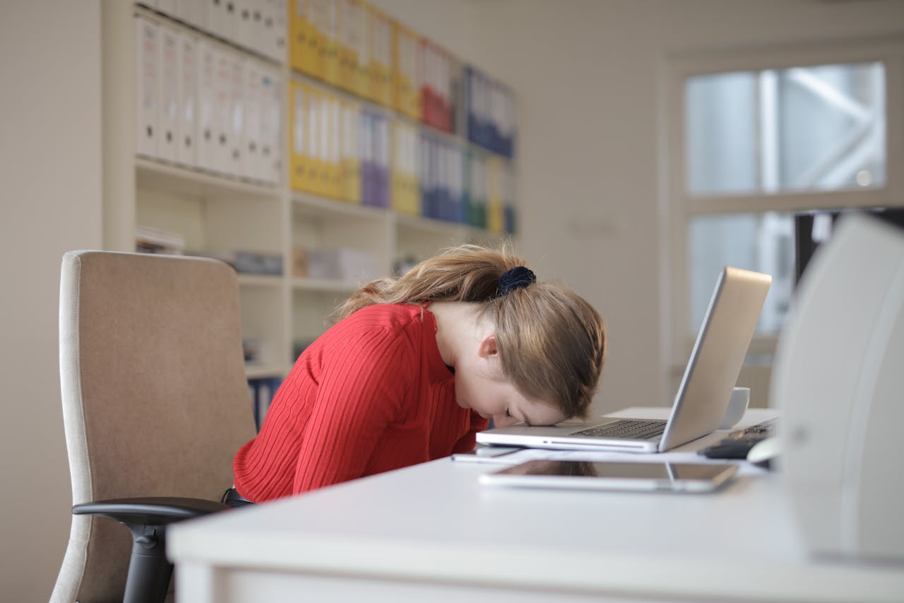 Woman tired working at her computer