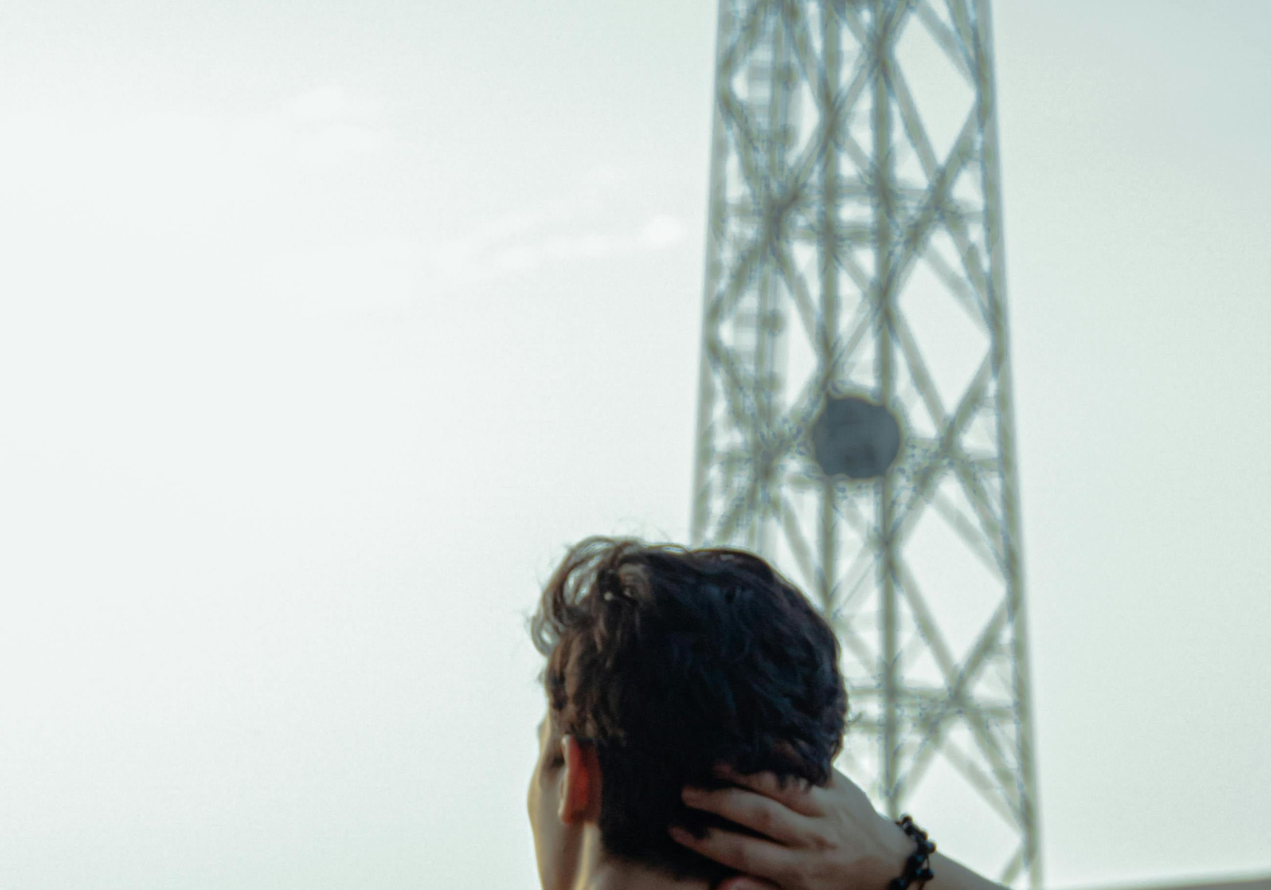 Man in front of cell tower